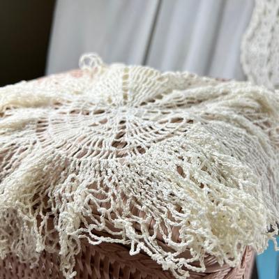 Mid century pink woven hamper and vintage linens