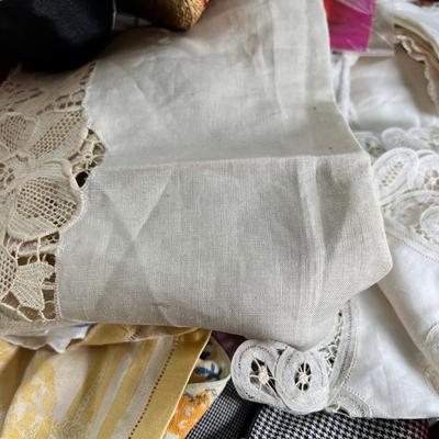 Mid century pink woven hamper and vintage linens