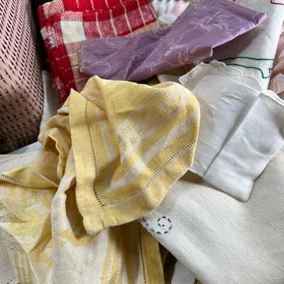 Mid century pink woven hamper and vintage linens