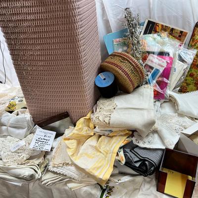 Mid century pink woven hamper and vintage linens