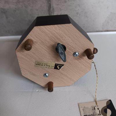 A STAUBACH KISSING DUTCH FIGURINES AND SCHMID ROTATING MUSIC BOX