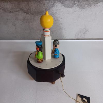 A STAUBACH KISSING DUTCH FIGURINES AND SCHMID ROTATING MUSIC BOX