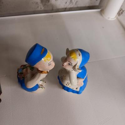 A STAUBACH KISSING DUTCH FIGURINES AND SCHMID ROTATING MUSIC BOX