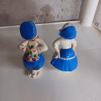 A STAUBACH KISSING DUTCH FIGURINES AND SCHMID ROTATING MUSIC BOX
