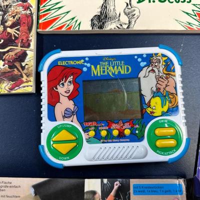 CHILDREN'S BOOKS AND 2 HAND HELD GAMES