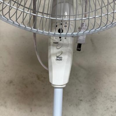 BOX AND OSCILLATING FAN ON AN ADJUSTABLE STAND