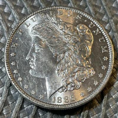 1886-P UNCIRCULATED CONDITION MORGAN SILVER DOLLAR (COIN #2) AS PICTURED.
