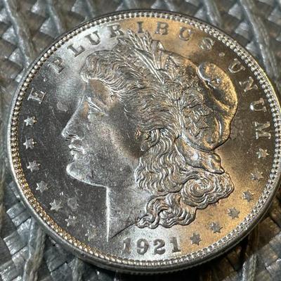 1921-P UNCIRCULATED CONDITION MORGAN SILVER DOLLAR (COIN #4) AS PICTURED.