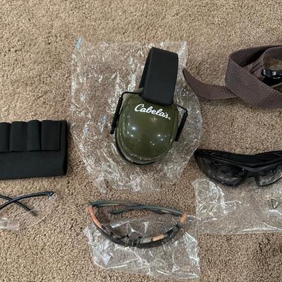 MAGAZINE HOLDER, CABELAS SAFETY EAR MUFFS, SAFETY GLASSES AND LEATHER BAG WITH BELT