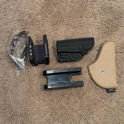 2 PISTOL HOLSTERS, SAFETY GLASSES AND SHELL SPEED STRIPPERS