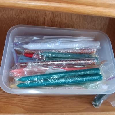 AN ASSORTMENT OF TAPERED CANDLES