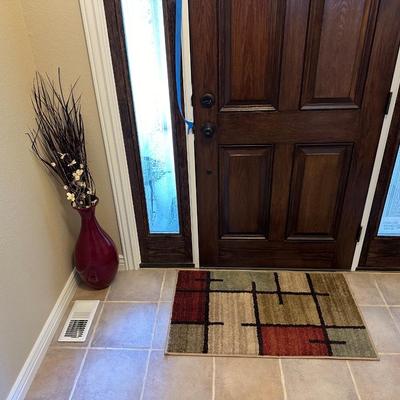 FLOOR VASE W/DRIED FOLIAGE AND AN ACCENT RUG