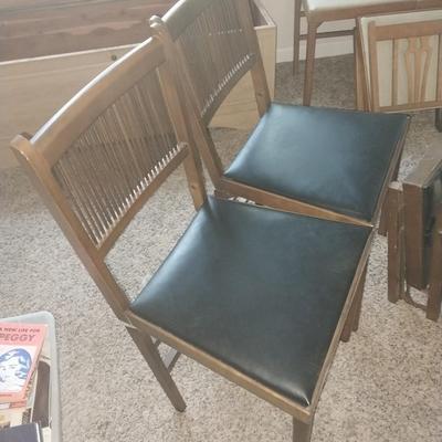 FOUR VINTAGE WOODEN FOLDING CHAIRS