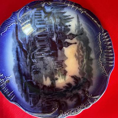 Beautiful, gold, trimmed blue, and white gravy boat along with over variety of saucers, dipping plates, and salad plates