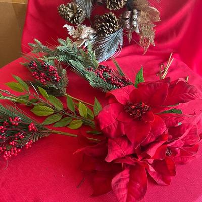 Decorative Christmas decor, flowers poinsettias, along with pinecone wreath