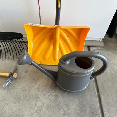 YARD TOOLS AND A WATERING CAN