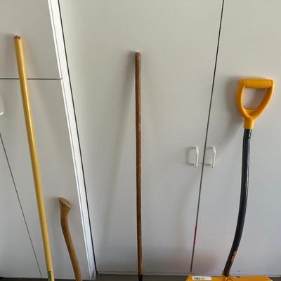 YARD TOOLS AND A WATERING CAN