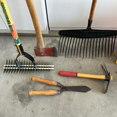 YARD TOOLS AND A WATERING CAN