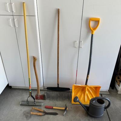 YARD TOOLS AND A WATERING CAN