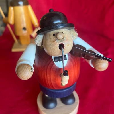 Unique wood carved figurines with pipes one is an incense holder