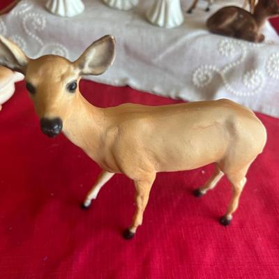 2 plastic reindeer, with three small angels that are bells A plastic candle holder that plugs into the wall and the package of small gold...
