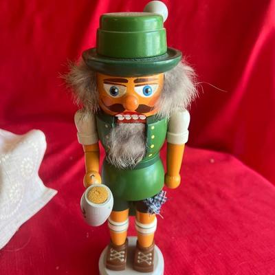 Christmas decor three nutcrackers a Beautiful crystal Christmas tree and paperweight