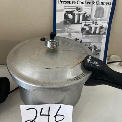 Pressure cooker pot with guide and chrome two piece to