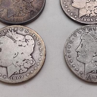 Set of Four U. S. Mint Mogan Silver Dollars Various Dates and Wear Legible Dates (#300)