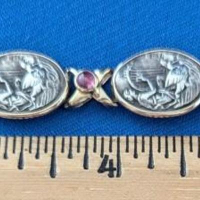 14K and Sterling silver bracelet with 6 embossed silver scenes and 7 amethyst cabachons Safety latch
