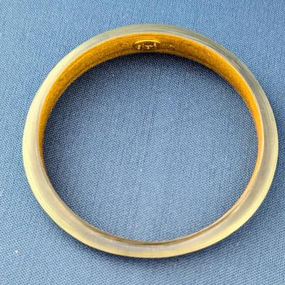 Pair of Alexis Bittar textured Lucite tapered bangle bracelets. Soft blue with gold inside.
