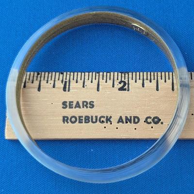 Pair of Alexis Bittar textured Lucite tapered bangle bracelets. Soft blue with gold inside.
