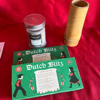 2 Dutch games with directions a candle and a cup make from bamboo