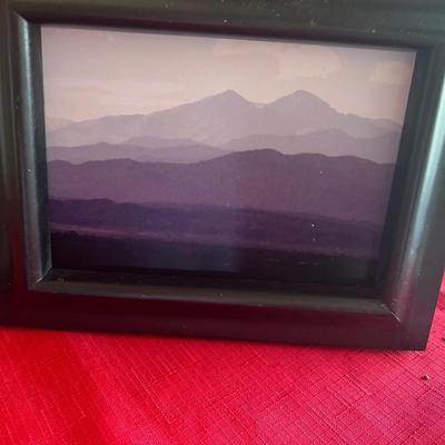 Several picture frames with pictures or your remove pictures and use the frames