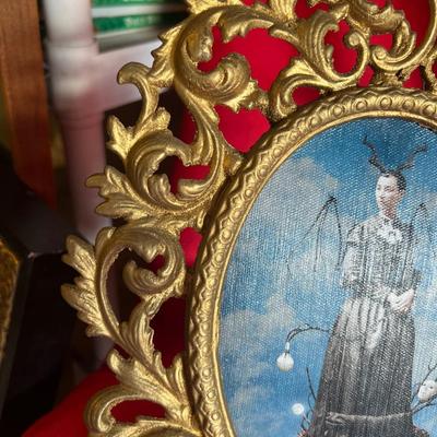 Variety of picture frames along with two small wall shelves for figurines or candles