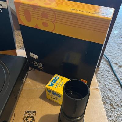 Kodak slide projector with attachments and Karrie case
