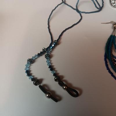 BEADED EYEGLASS CHAIN AND PIERCED EARRINGS PLUS A RHINESTONE PIN