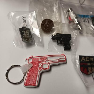 FIREARMS ADVERTISING & OTHER PINS AND KEYCHAINS PLUS 2 SECTIONED BOXES