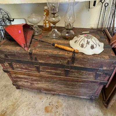 Table, Antique Trunk and hurricane lanterns