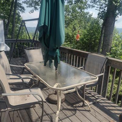 Metal Frame Patio Table with Glass Top, Four Chairs, and Umbrella