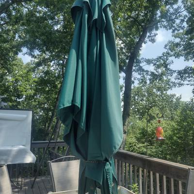 Metal Frame Patio Table with Glass Top, Four Chairs, and Umbrella