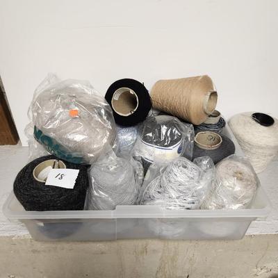 18 cones of yarn in greys