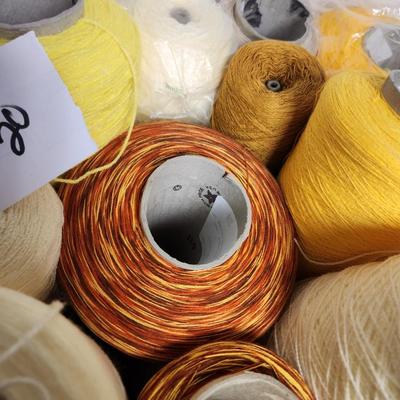 20 cones of yarn in yellow