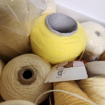 20 cones of yarn in yellow