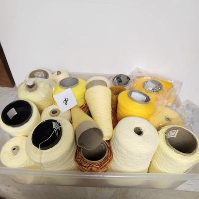 20 cones of yarn in yellow
