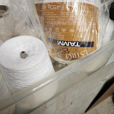 14 cones of yarn in white