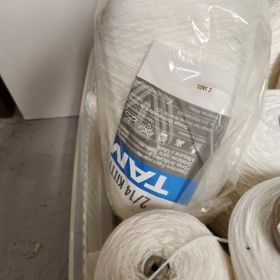 14 cones of yarn in white