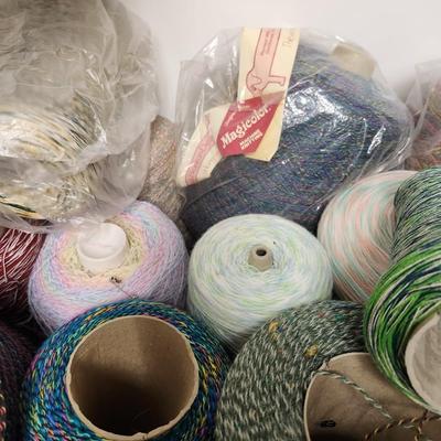 17 cones of multicolored yarn