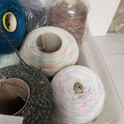17 cones of multicolored yarn