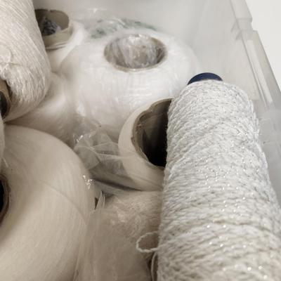17 cones of yarn in white