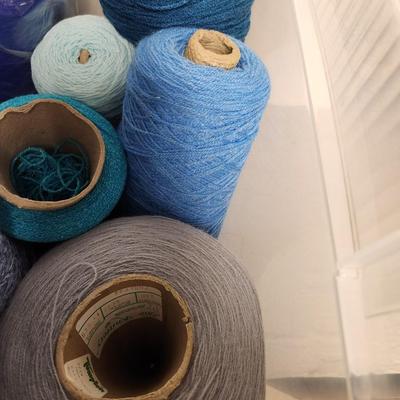 17 cones of yarn in blue